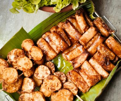 Appetizing Filipino street food served on banana leaves, capturing authentic flavors. Perfect for food lovers.
