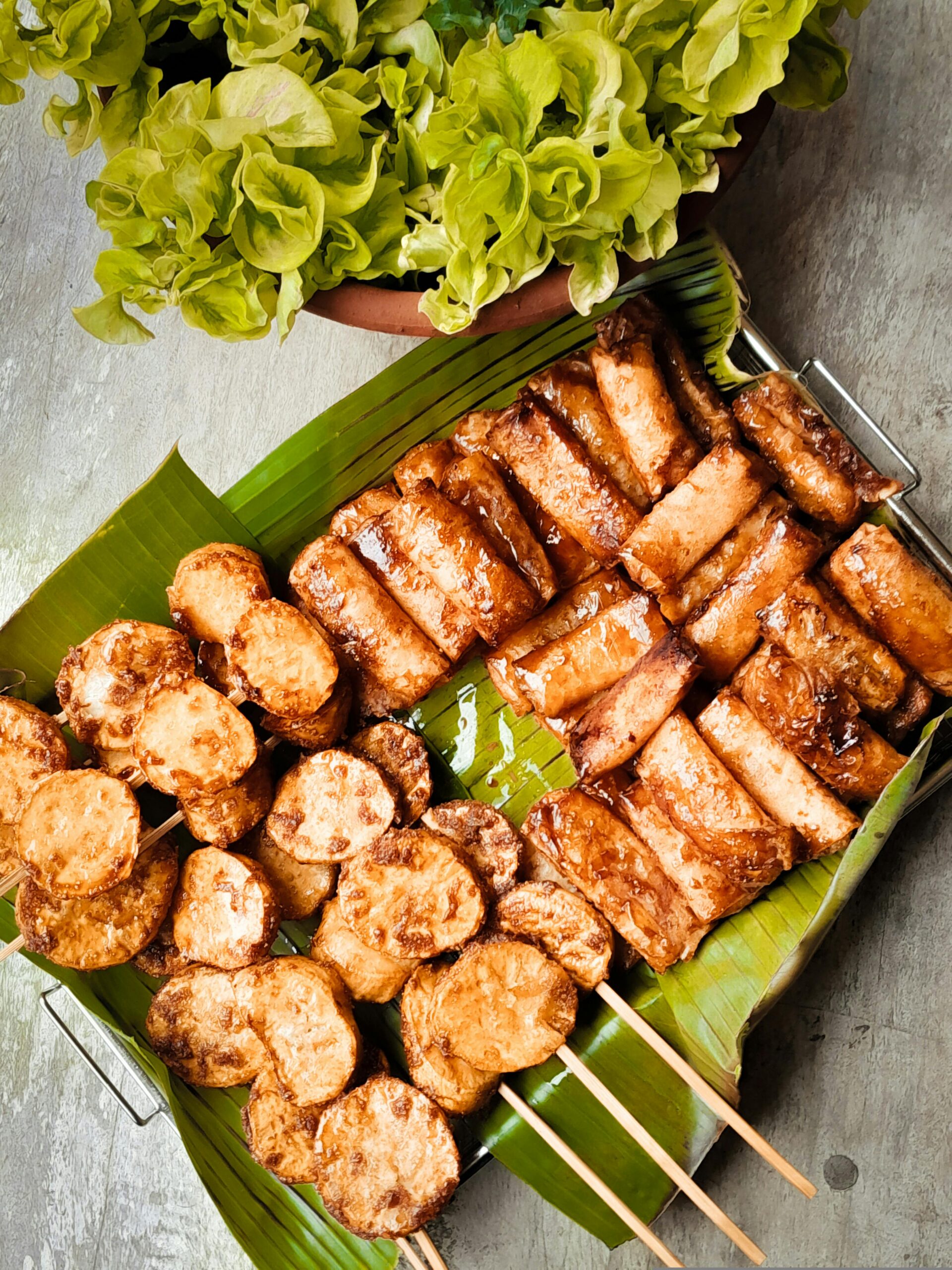Appetizing Filipino street food served on banana leaves, capturing authentic flavors. Perfect for food lovers.