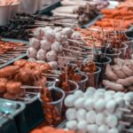 A vibrant display of diverse skewered street foods in Manila, showcasing local Filipino culinary culture.